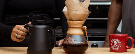 A Chemex pour over coffee and Kettle next to a bag of Death Wish Coffee.