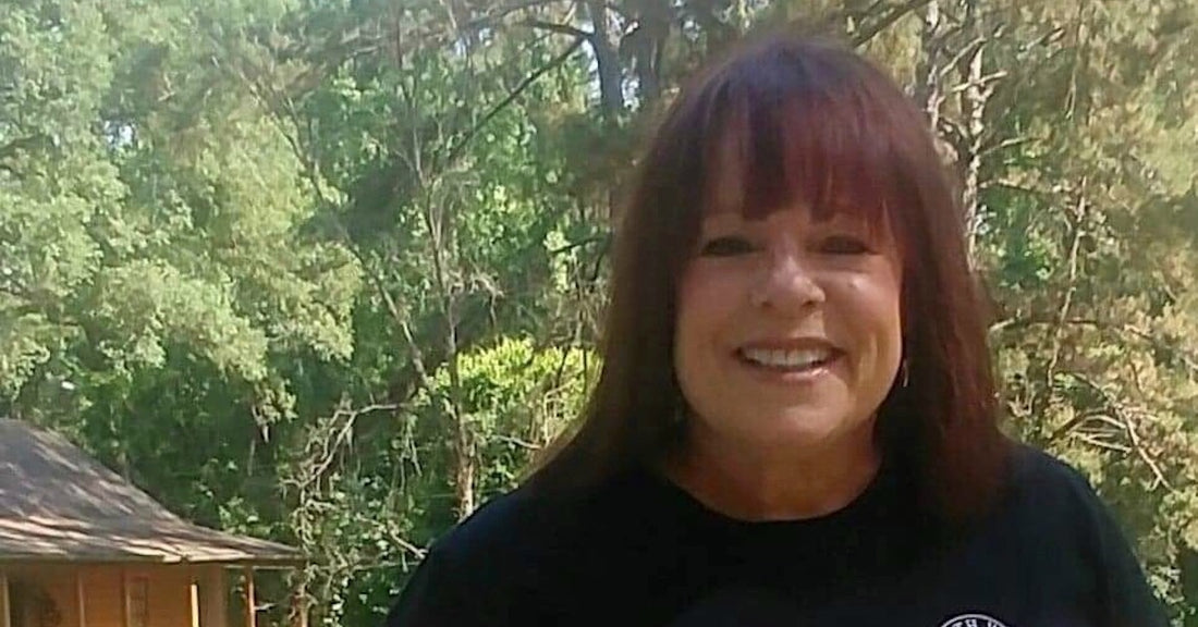 Gail Dunmyer in front of a forest