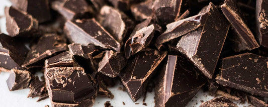 An image of chocolate crushed on a white backdrop. 