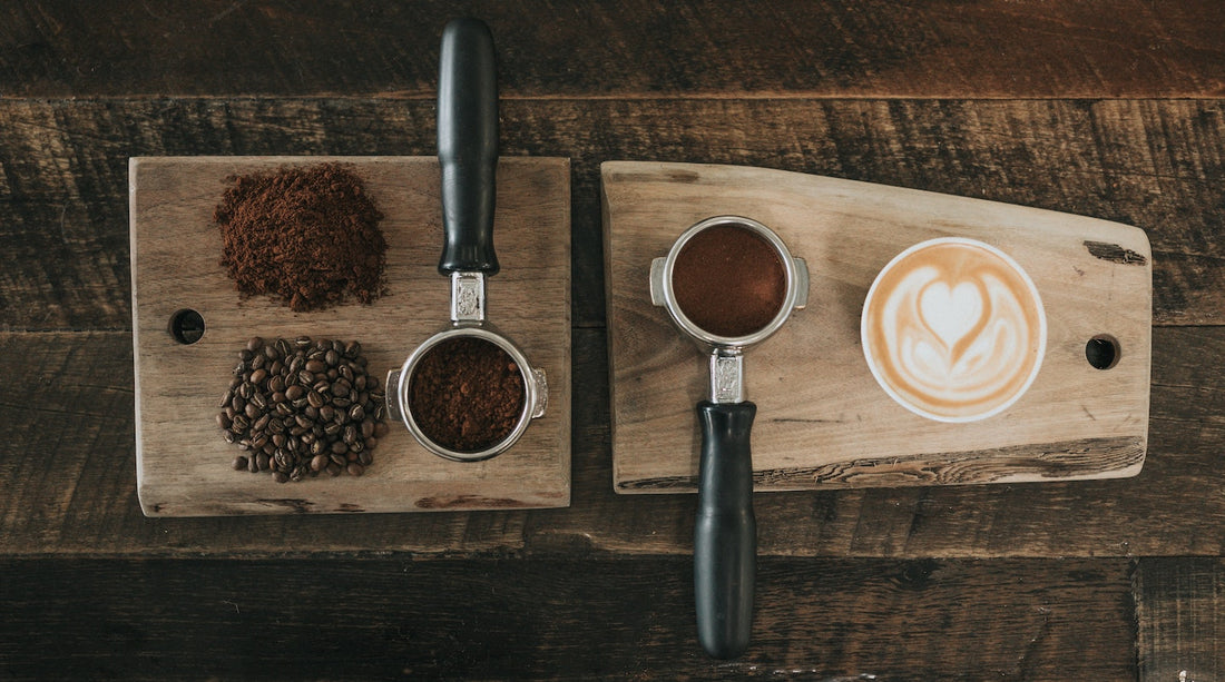 whole bean and ground coffee with a cup of coffee on a wooden table