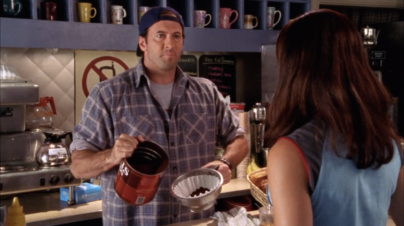 Luke serving coffee in Gilmore Girls