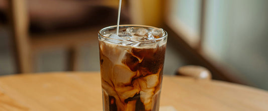 Kick off your summer with an iced latte at home. Image Source: Shuvro Mojumder via Unsplash