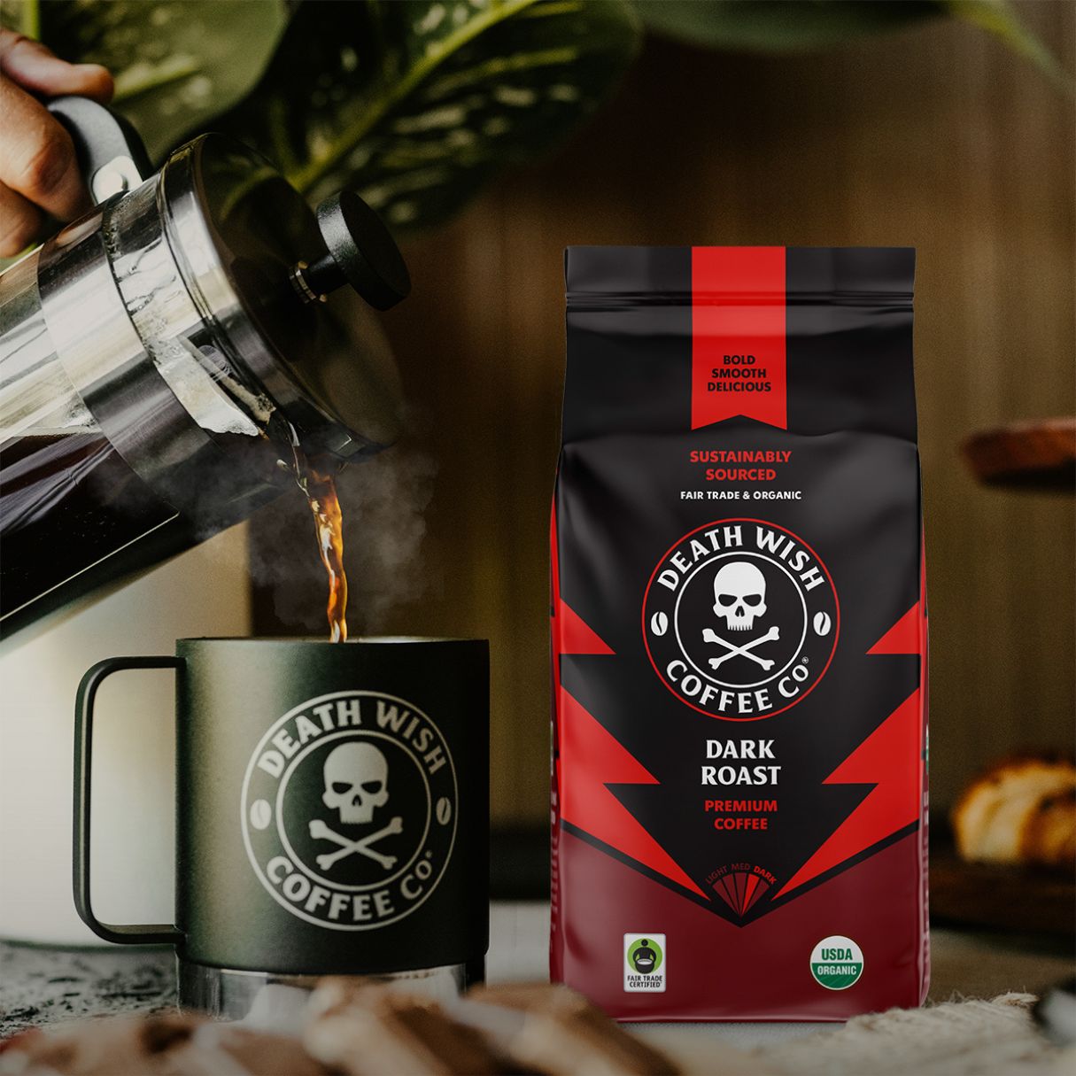 Pouring Dark Roast Death Wish Coffee into a mug.