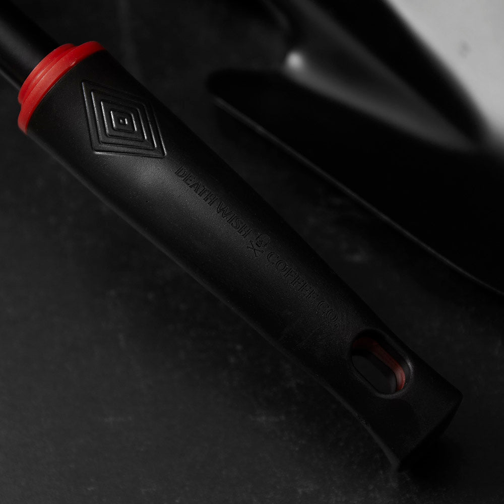A close up of the gardening tool handle from the Death Wish Coffee Brewtanical Gardening Set.