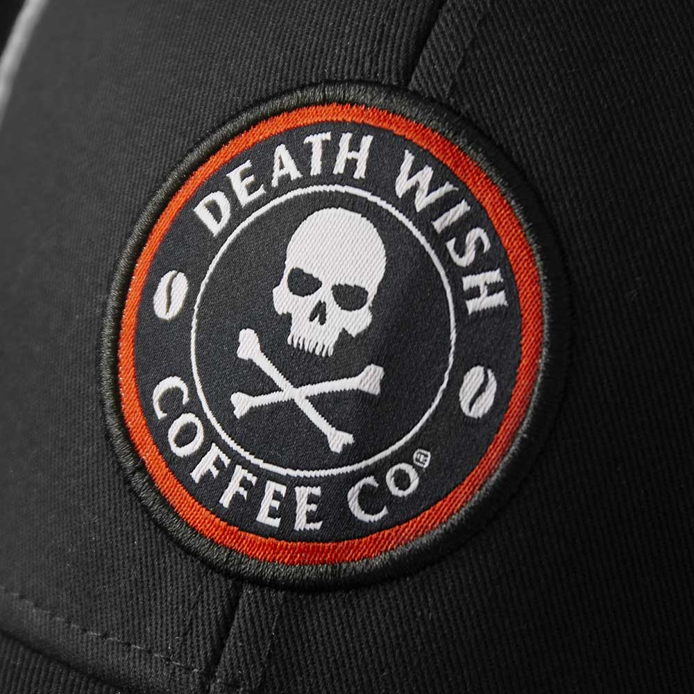A close up of the Death Wish Coffee Rebellious By Nature Trucker Hat.