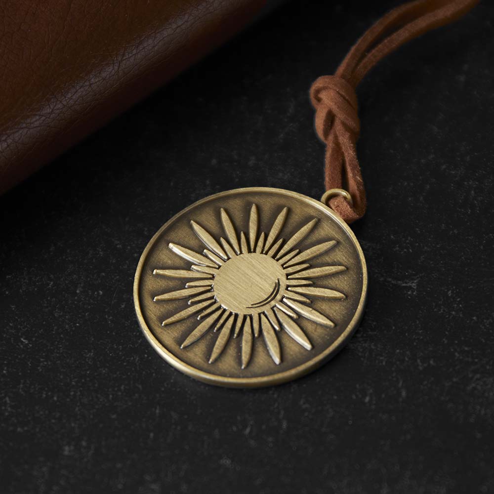 The sun medallion of the Death Wish Coffee Tree of Life Journal.