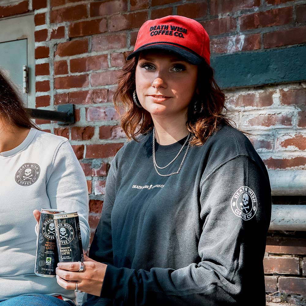 A model wearing the Death Wish Coffee Two-Tone Coffee & Cord Snapback.