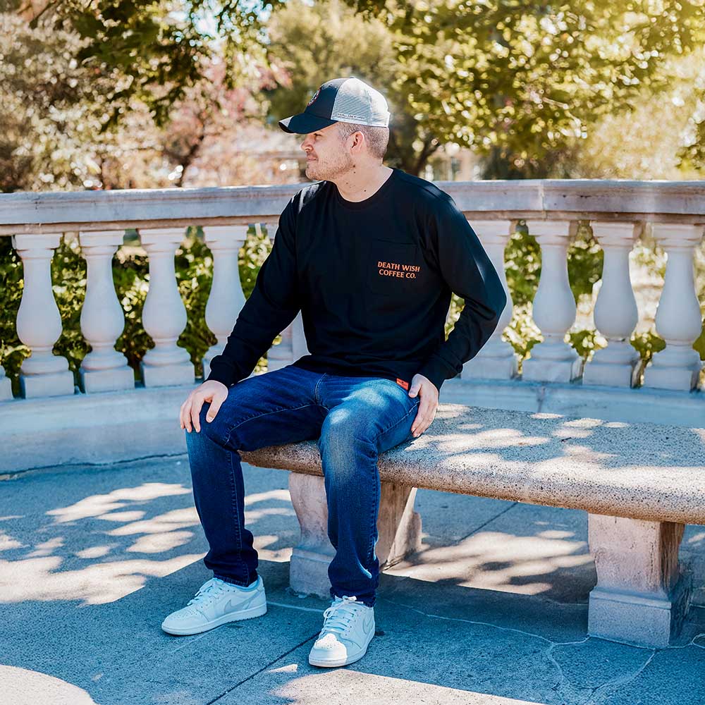 A model wearing the Death Wish Coffee Nothing to Hide Pocket Tee.