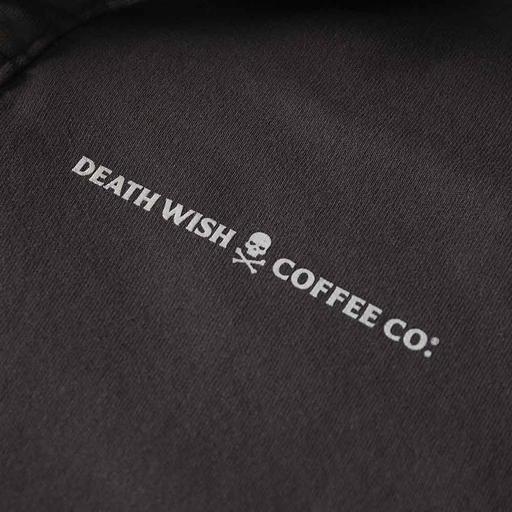 The logo detail of the Death Wish Coffee Collar Me Caffeinated Polo.