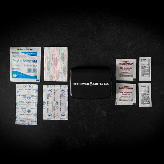 The full contents of the Death Wish Coffee Rub Some Grinds On It First Aid Kit.