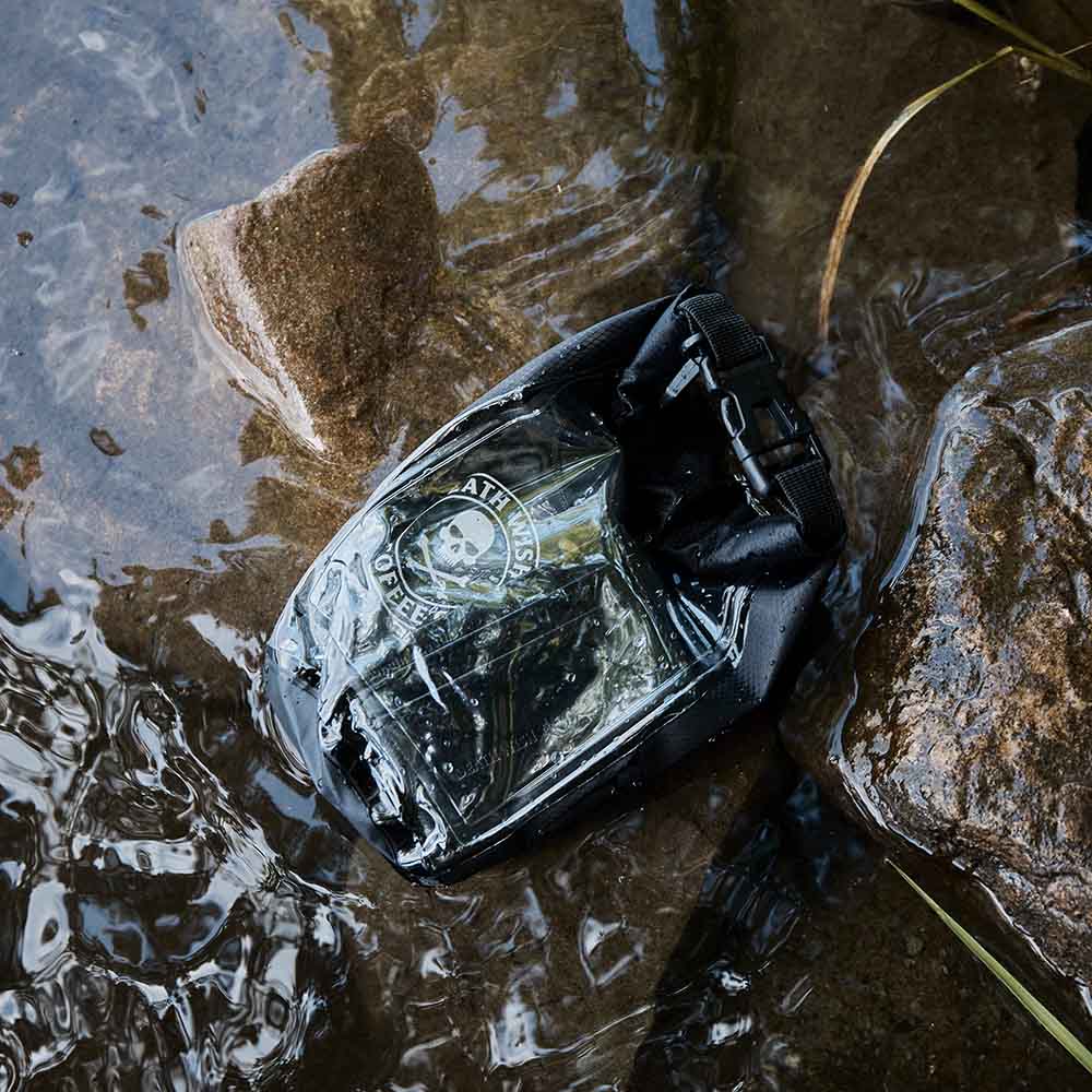 The Death Wish Coffee Rock The Boat Waterproof Bag submerged in water.