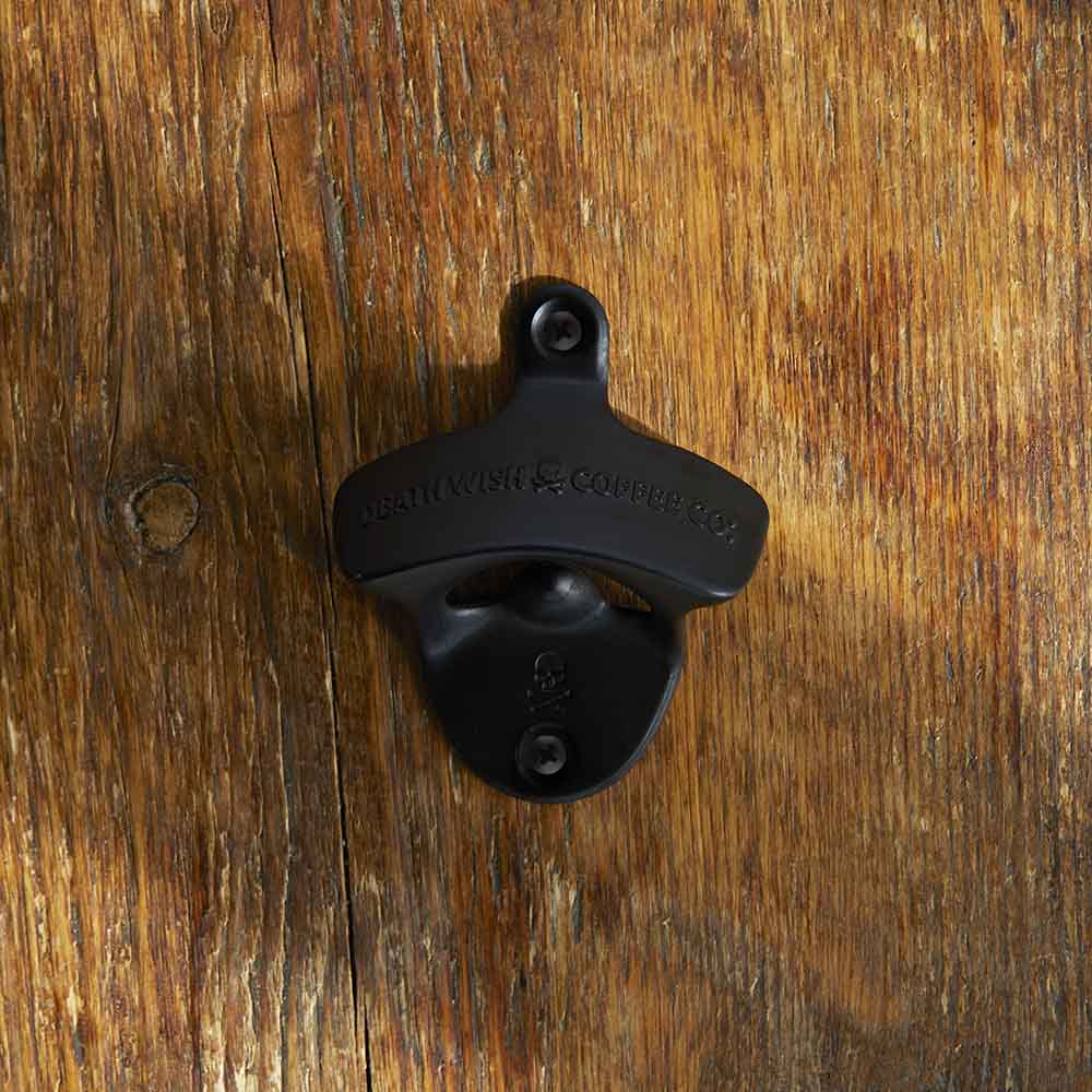 The Death Wish Coffee Death Grip Bottle Opener on a wall.