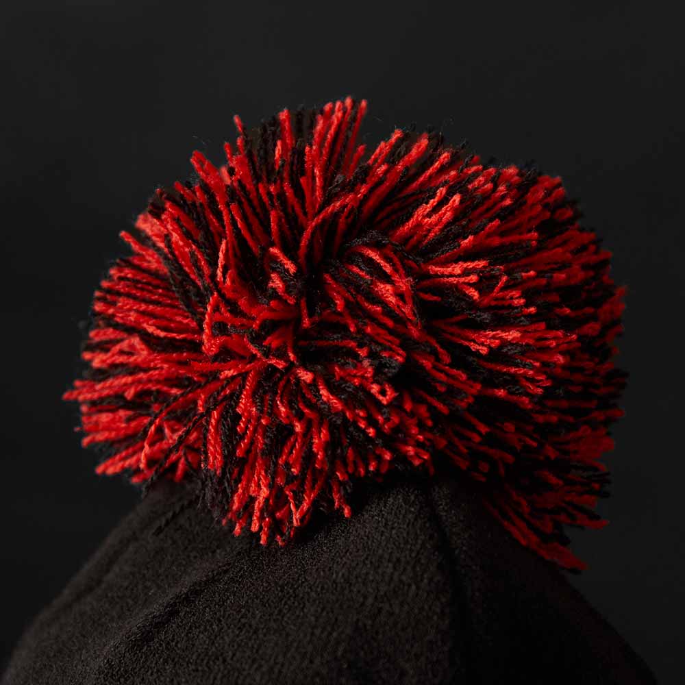 The pom of the Death Wish Coffee Bolt Brain Beanie.