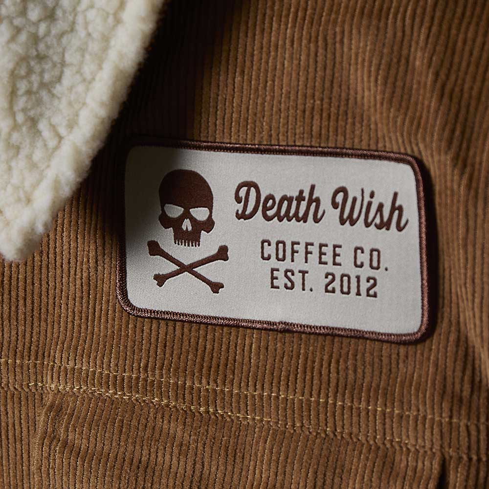 A detail shot of the Death Wish Coffee Daily Grind Women's Corduroy Workwear Jacket.