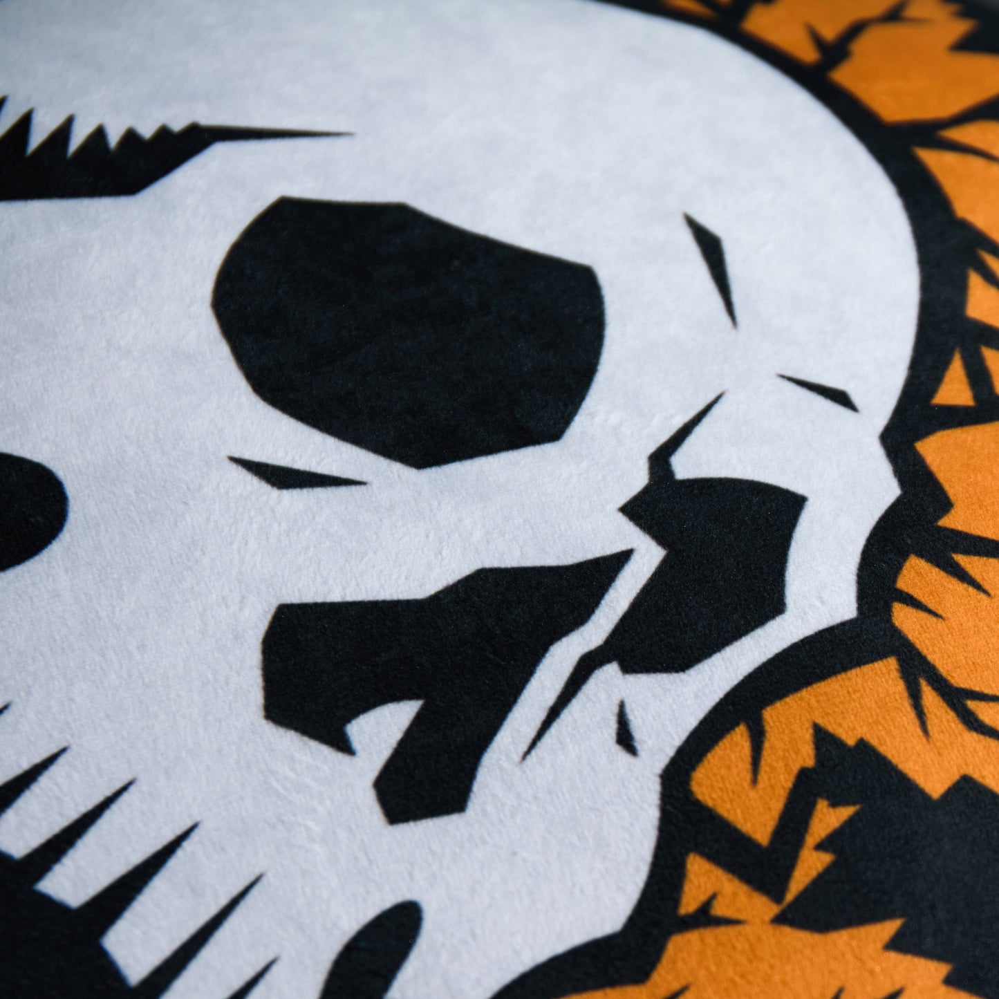 A close up of the Death Wish Coffee Maple Cinnamon Flavor Skull Pillow.