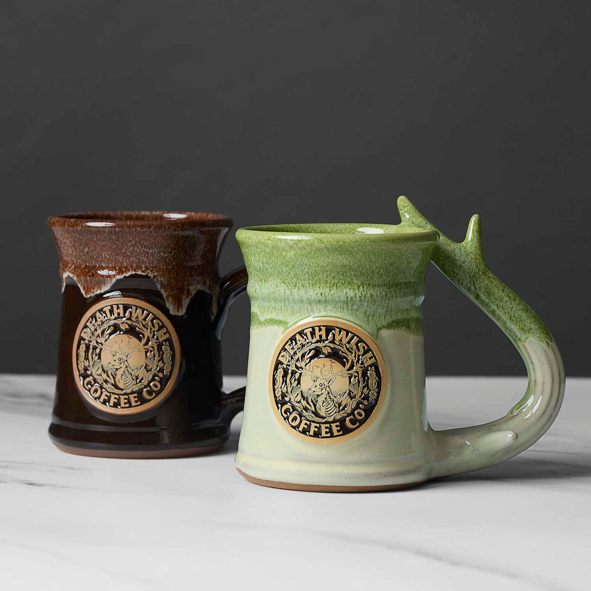 The Death Wish Coffee Call of the Wild Mug and Golden Ticket variation side by side.