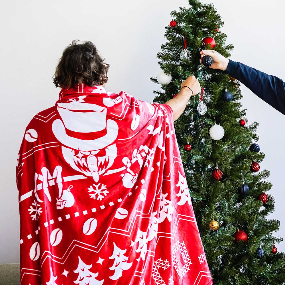 Decorating the tree in the Death Wish Coffee & Chill Blanket.