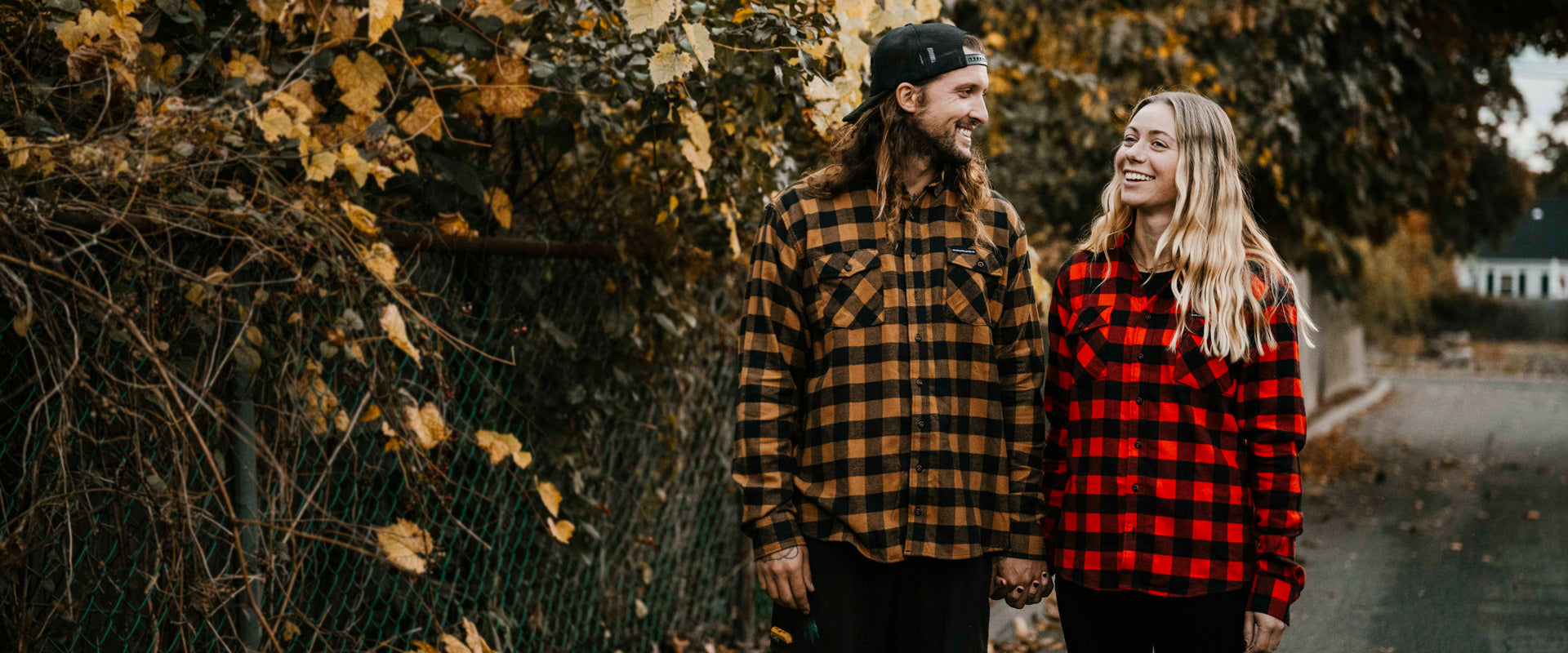 A couple wearing the Death Wish Coffee Dark Roast + Medium Roast Flannels