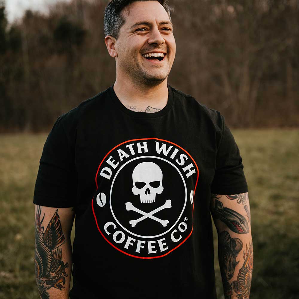 A man with tattoos wearing the Death Wish Coffee Core Classic Logo Tee.