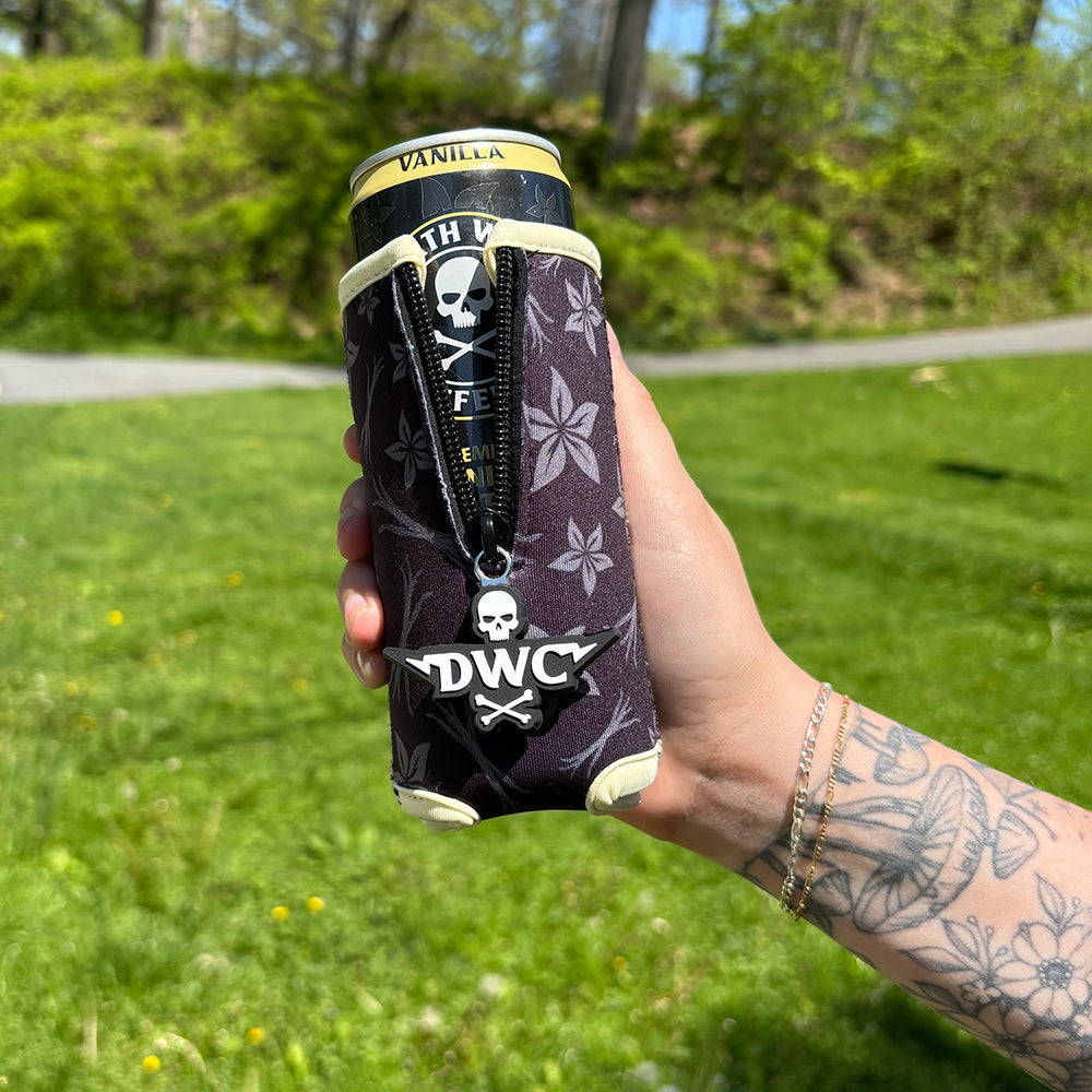 A hand holding the Death Wish Coffee Vanilla Slim Can Koozie.