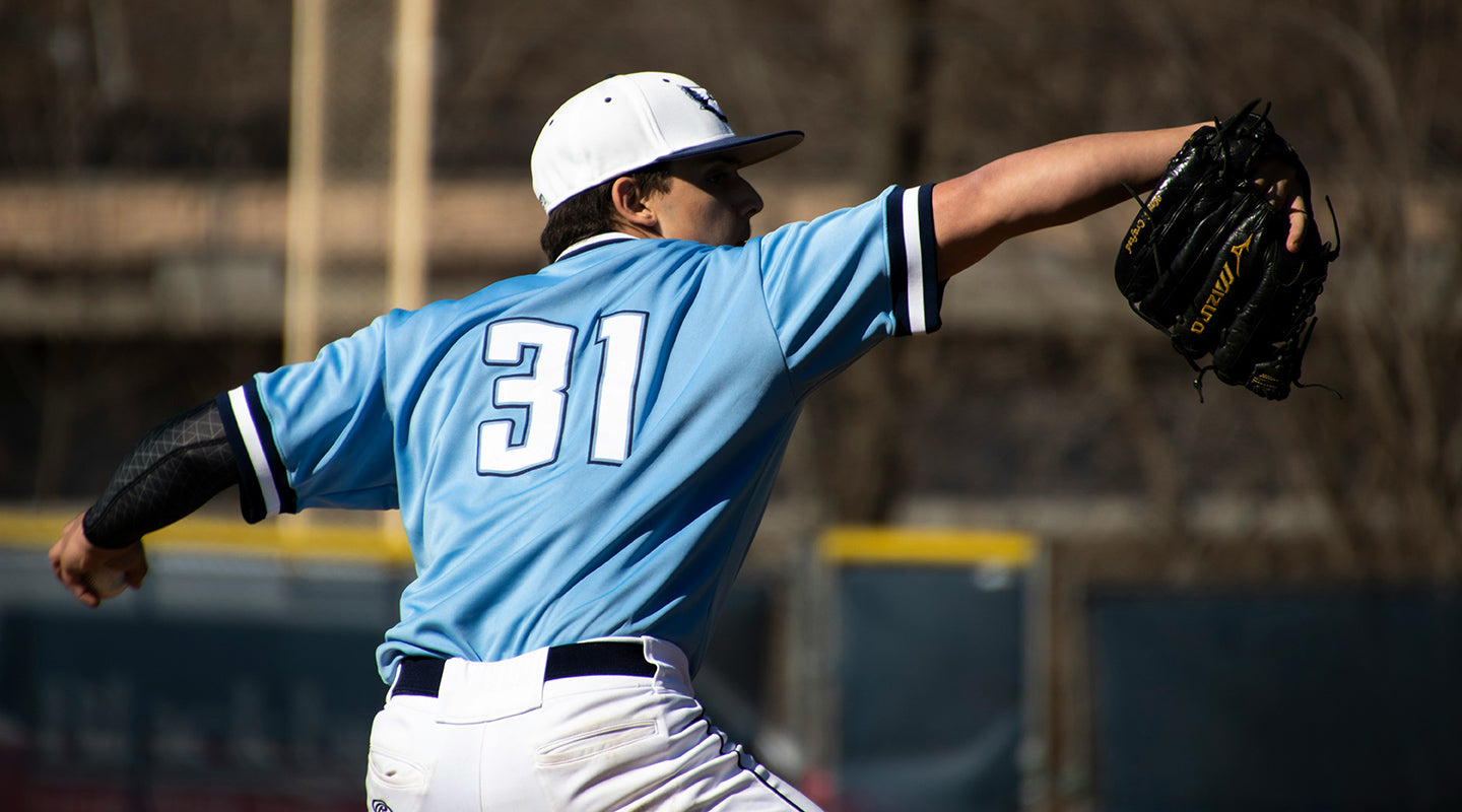 A baseball pitcher mid throw. Source: Katrina Berban via Unsplash.