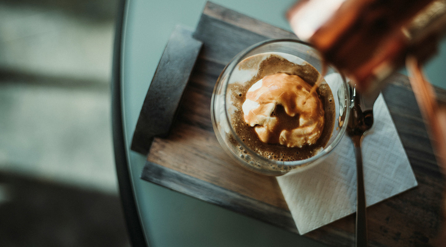 Topping off a freshly made affogato.