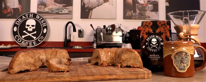 A kitchen counter with a loaf of Gingerdeadly french toast, a mug and a bag of Gingerdead Coffee.