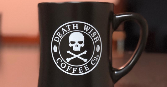A classic black mug with a white Death Wish Coffee logo.