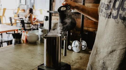 Brewing coffee using a french press.