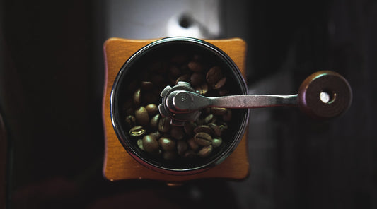 Looking down onto coffee beans in grinder