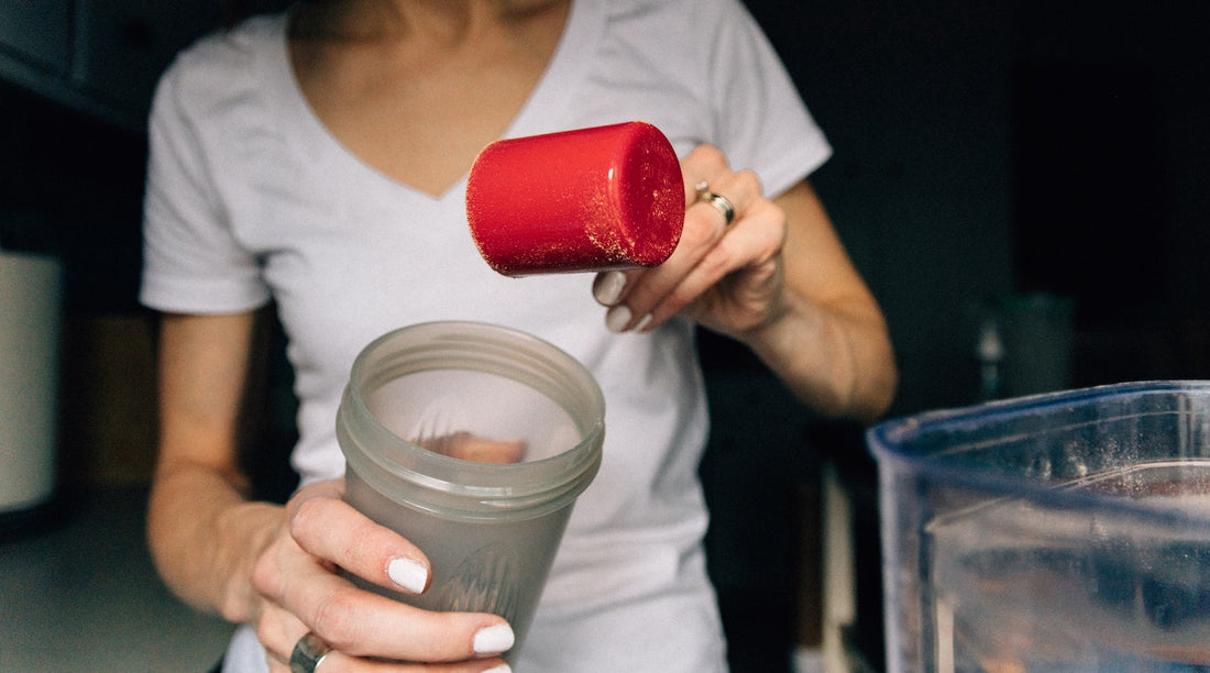 Person scooping protein powder
