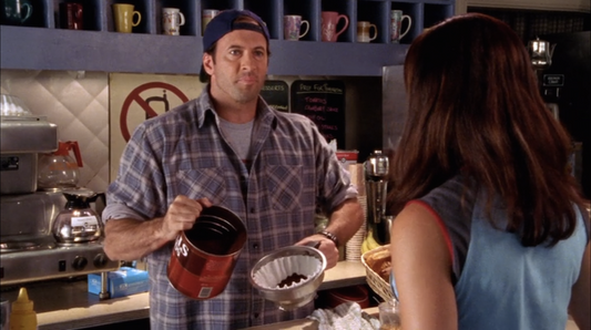 Luke serving coffee in Gilmore Girls