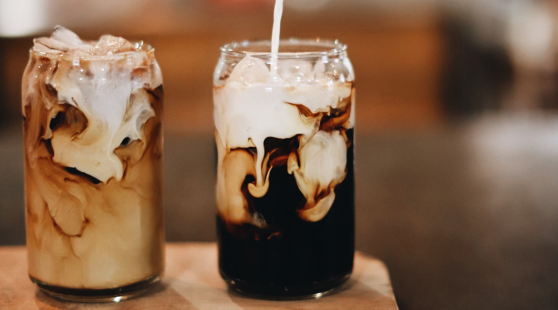 two glasses filled with iced coffee