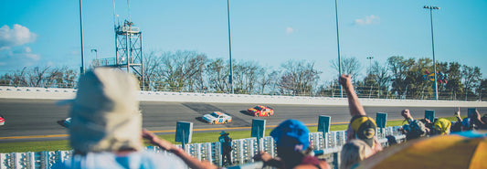 A group of fans watching the Daytona 500 at Daytona International Speedway.