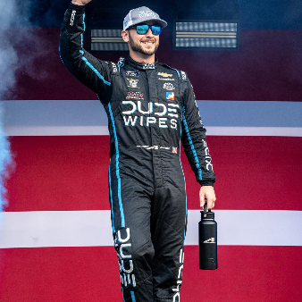 Anthony Alfredo waving to a crowd of spectators.