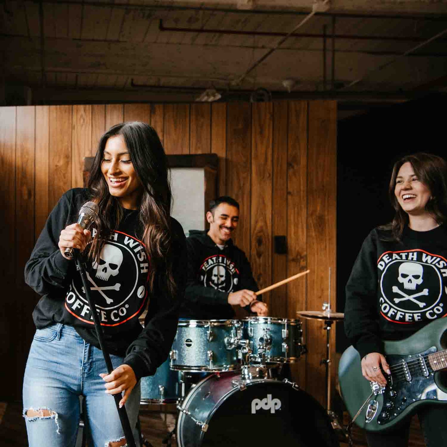 Singing during band practice in the Death Wish Coffee Classic Logo Long Sleeve Shirt.