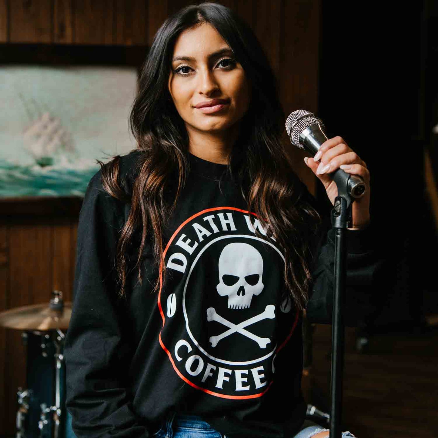 Adjusting the mic in the Death Wish Coffee Classic Logo Long Sleeve Shirt.