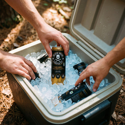 Grabbing Death Wish Coffee Cold Brew Canned Lattes out of a cooler full of ice.