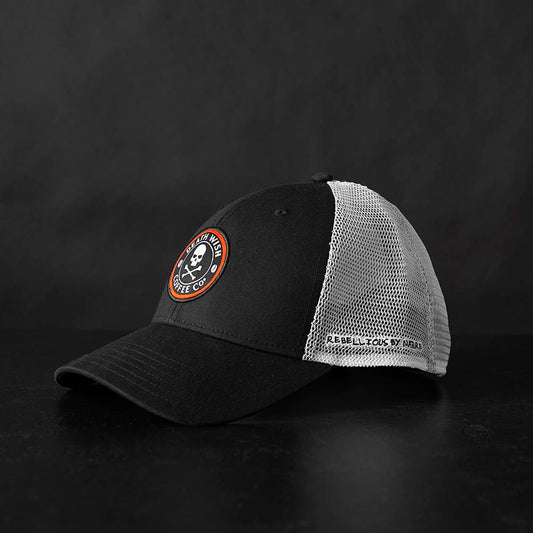 The left side of the Death Wish Coffee Rebellious By Nature Trucker Hat.