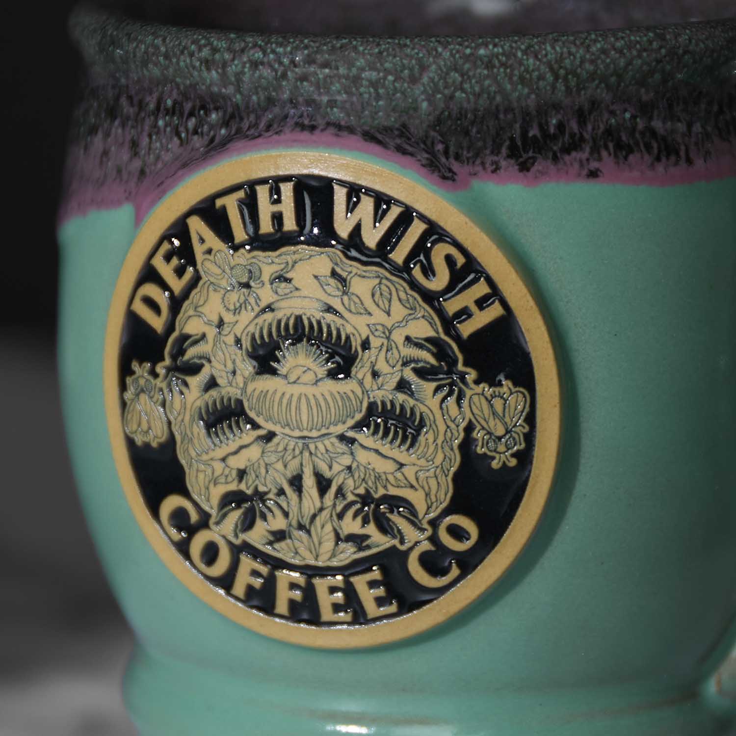 The medallion of the Death Wish Coffee Venus Fly Trap Mug.
