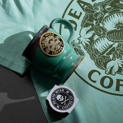 The Death Wish Coffee Venus Fly Trap Mug with a matching tee and free mini planter.