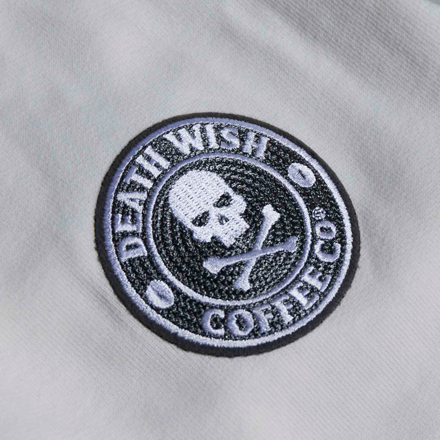 A detail shot of the sleeve of the Death Wish Coffee Brews Cruise Pullover.