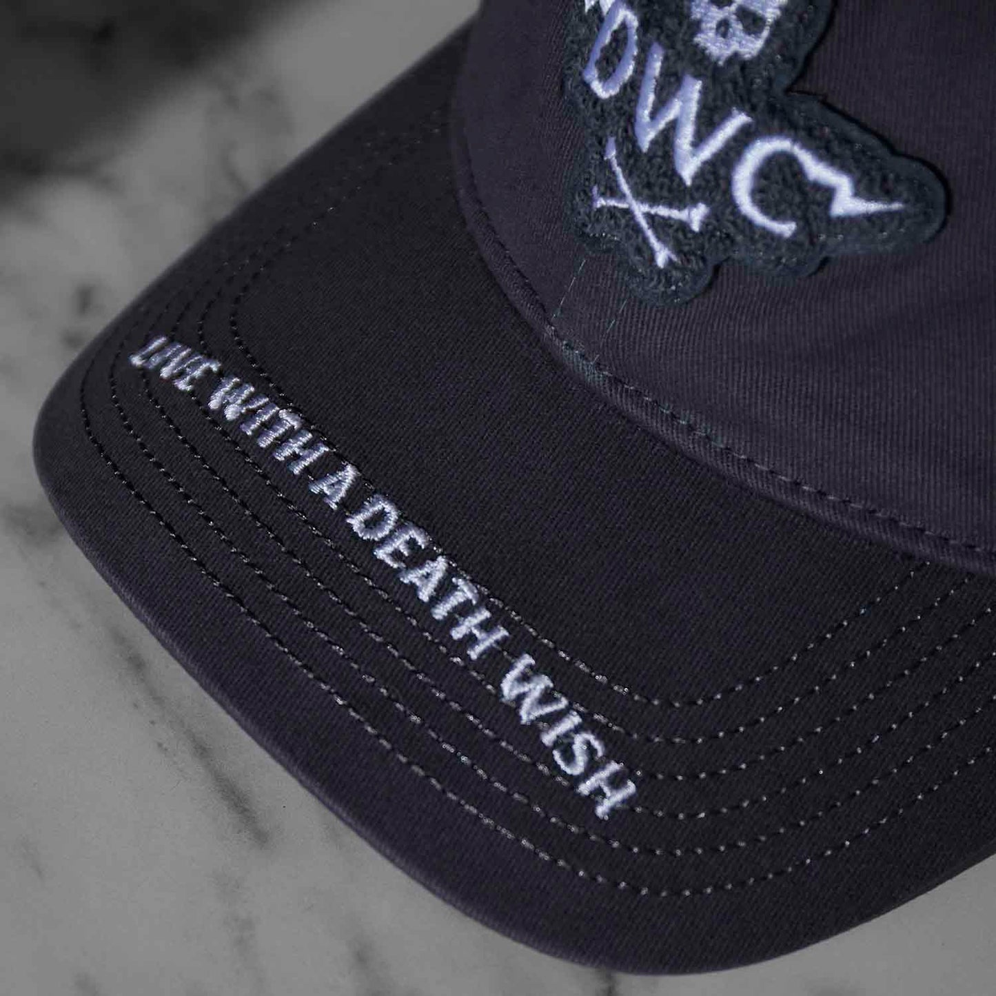 Visor detail of the Death Wish Coffee Daily Directive Snapback.