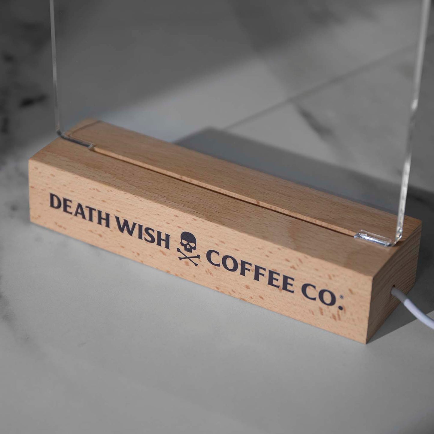 A detail shot of the Death Wish Coffee Caffeine Catalyst LED Dry Erase Board base.