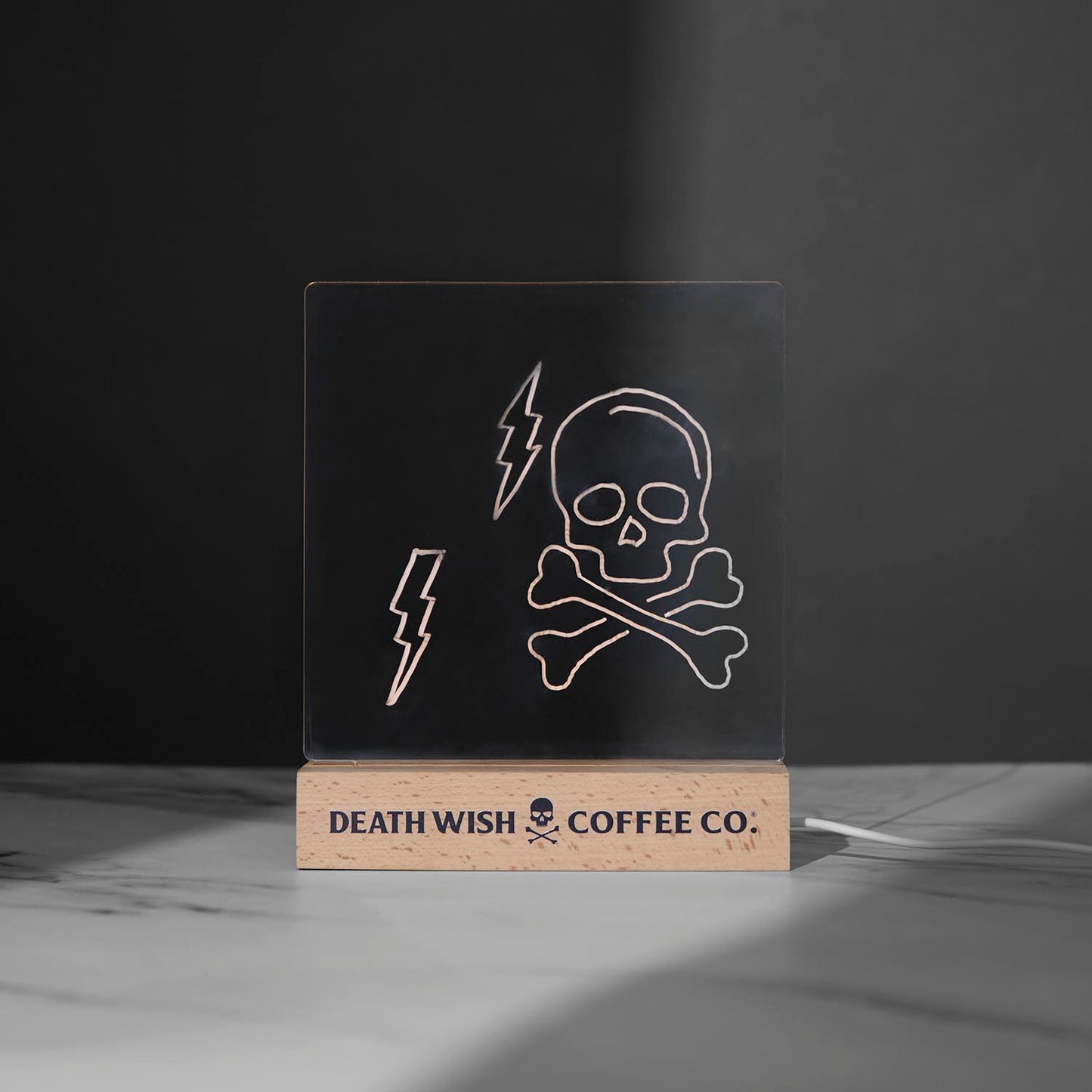 The Death Wish Coffee Caffeine Catalyst LED Dry Erase Board with a skull and crossbones drawing.