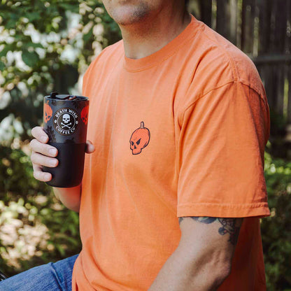A model holding the Death Wish Coffee Pumpkin Chai Klean Kanteen (16oz).