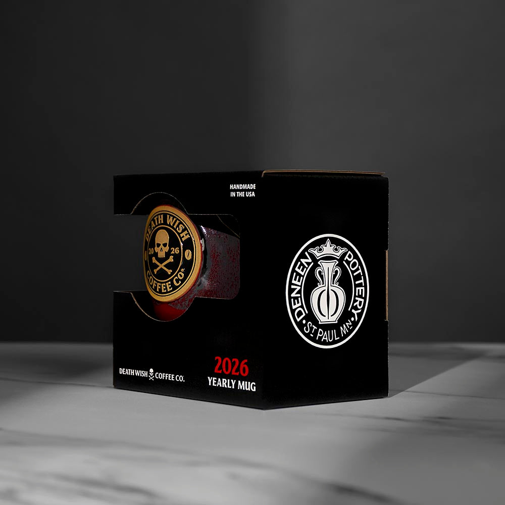 A side view of the 2026 Death Wish Coffee Mug in its custom display box.