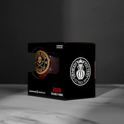 A side view of the 2026 Death Wish Coffee Mug in its custom display box.