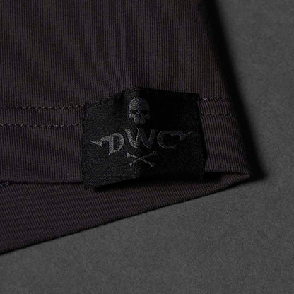 A black woven label sewn into the left hip of the Death Wish Coffee Erebus Embossed Tee.