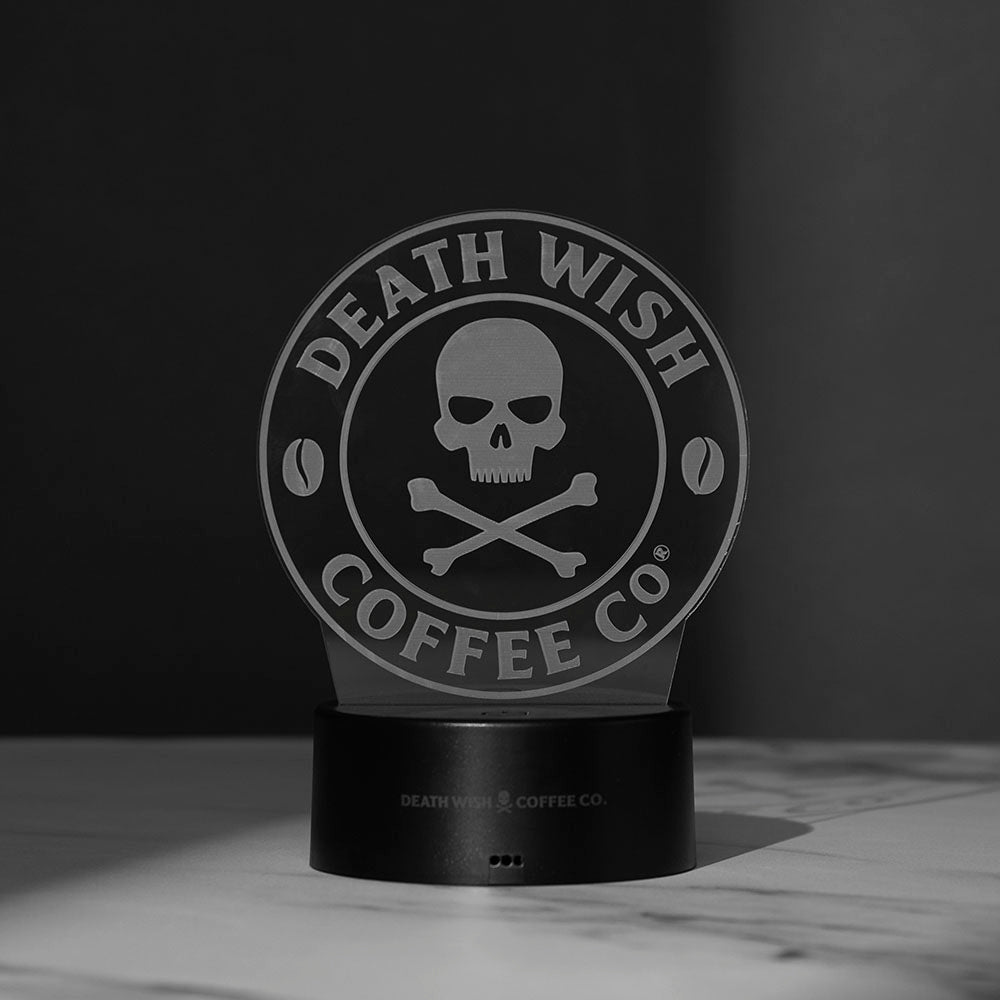 The Death Wish Coffee Neon Necromancer LED Light with the skull and crossbones logo acrylic insert turned off.